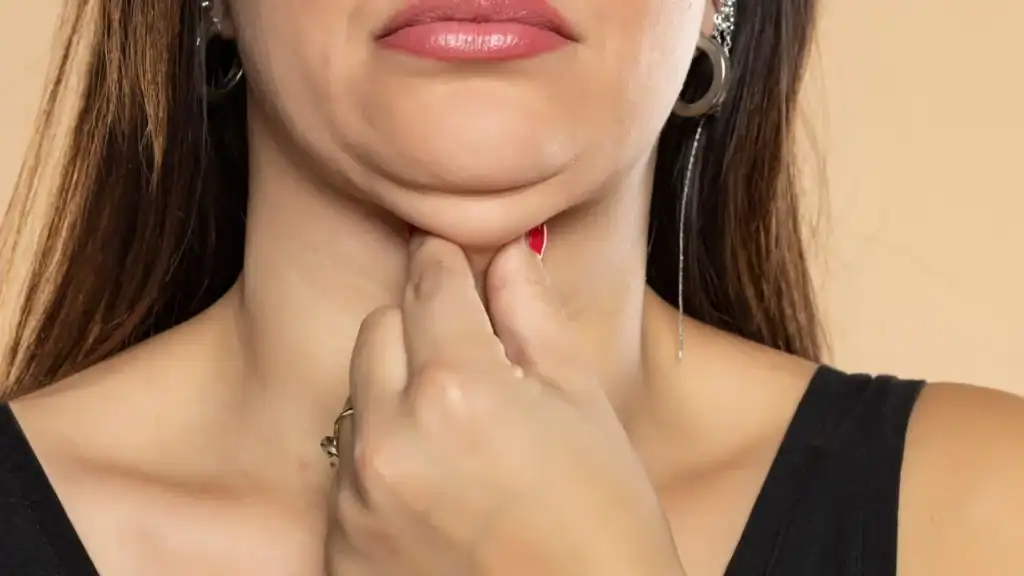 An image of a woman with double chin, sad, worried : Non Surgical Double Chin Removal Treatment in Chapeltown, UK